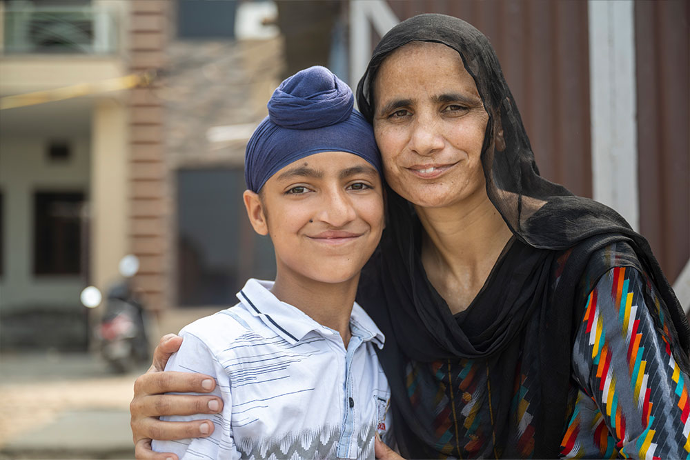 Anmolpreet smiling with his mother Tarsem after his cleft surgery