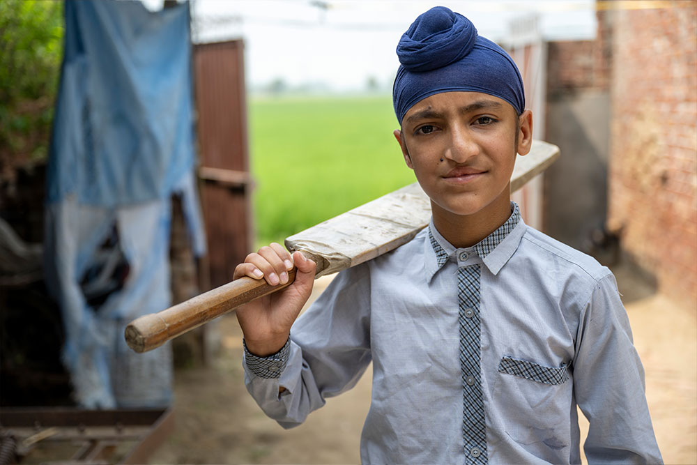 Anmolpreet holding his cricket wicket