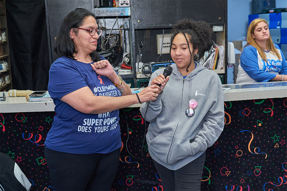 Sally and Dahlila speaking about their cleft journey before a Bowling for a Cause event