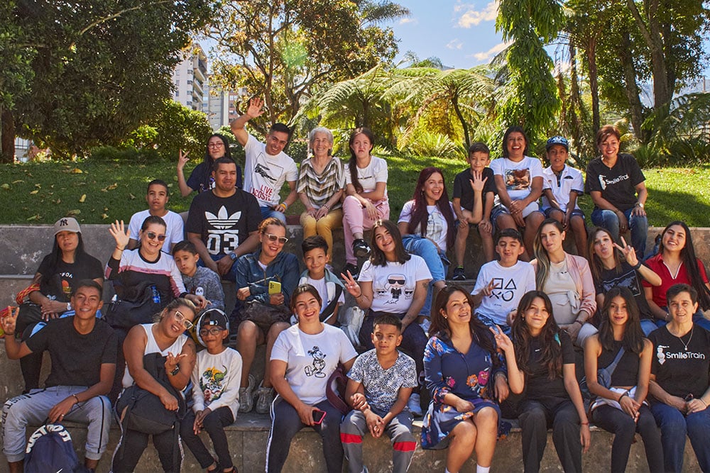 Sports camp participants pose with their parents