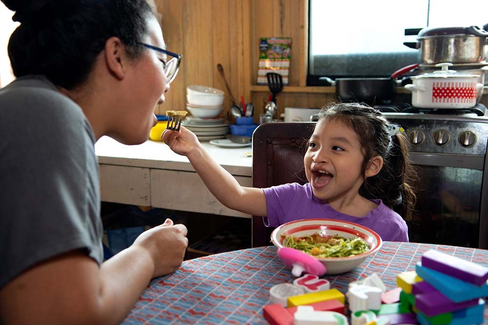 Itzayana playfully feeding her mom