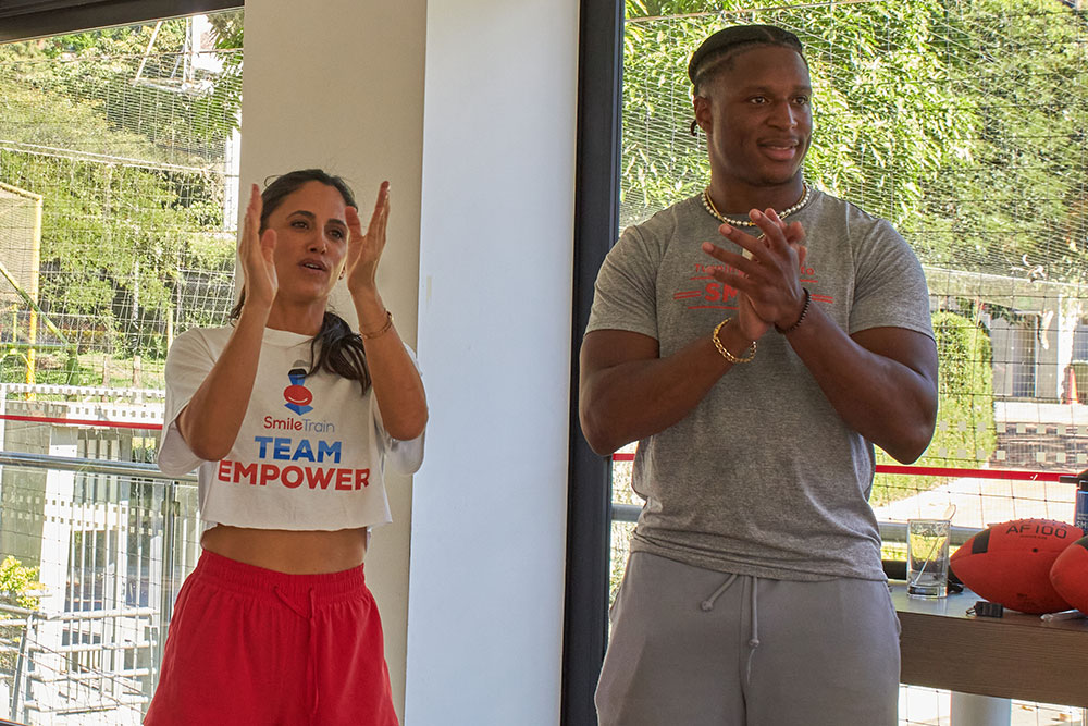 Jennifer Jacobs and Kenyan Drake at youth sports camp