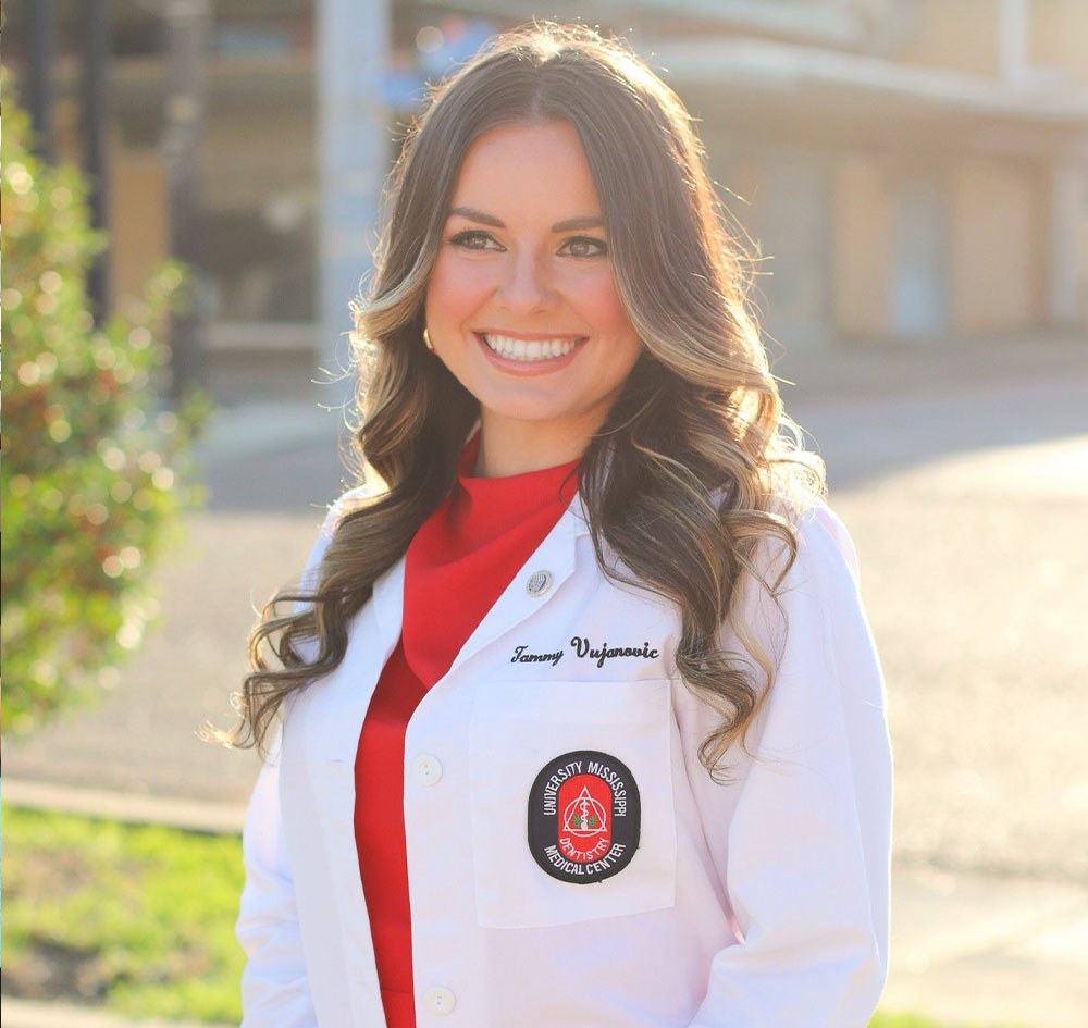 Tammy in her dental school lab coat