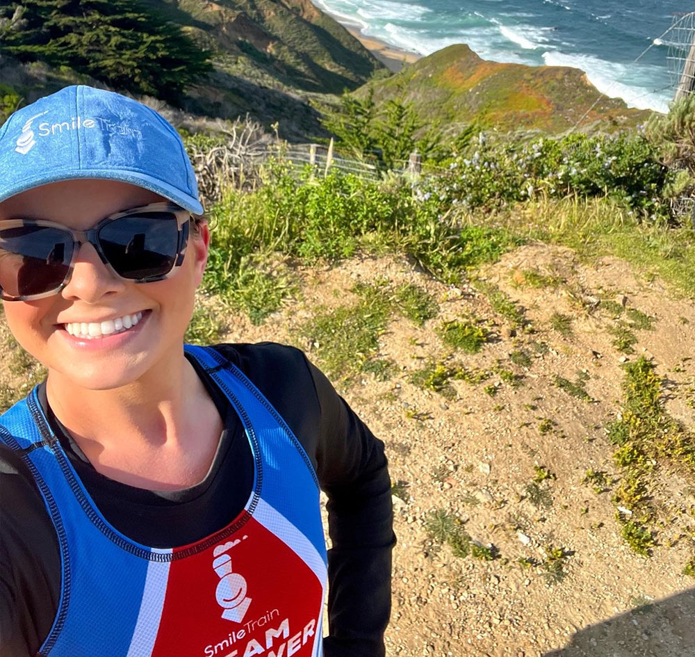 Tammy takes a selfie on the cliffs at the Big Sur International Marathon