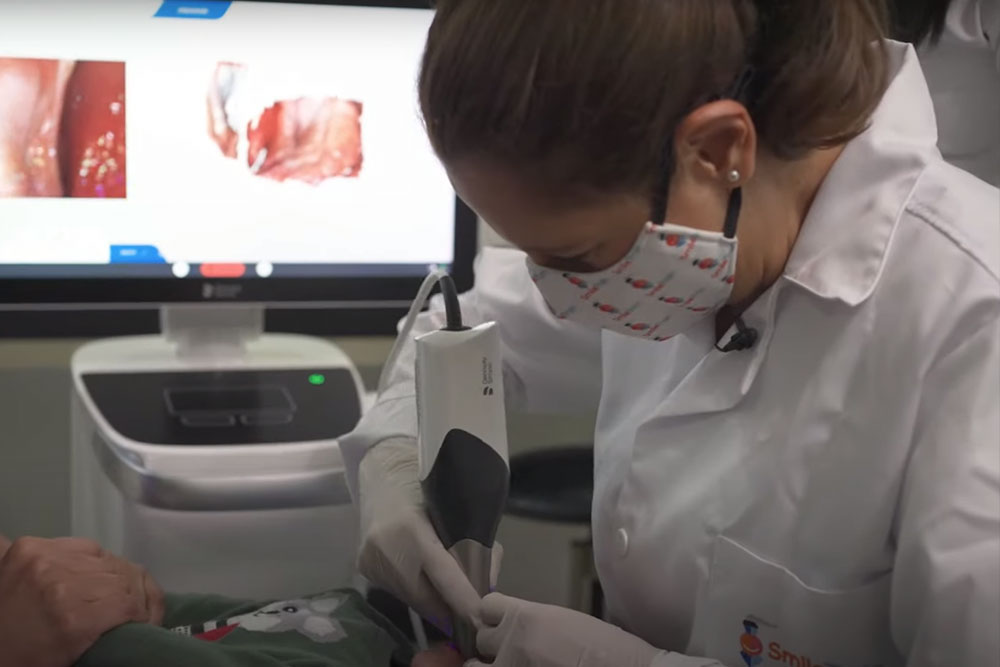 A baby receiving an intraoral scan at a Smile Train partner cleft treatment center in Colombia