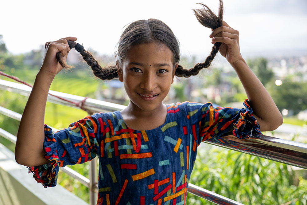 Simrik raising her braids like Pippi Longstocking