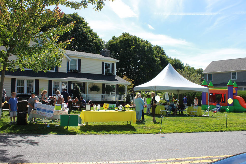 Tents, tables, and a bouncy castle outside the Pastorellis