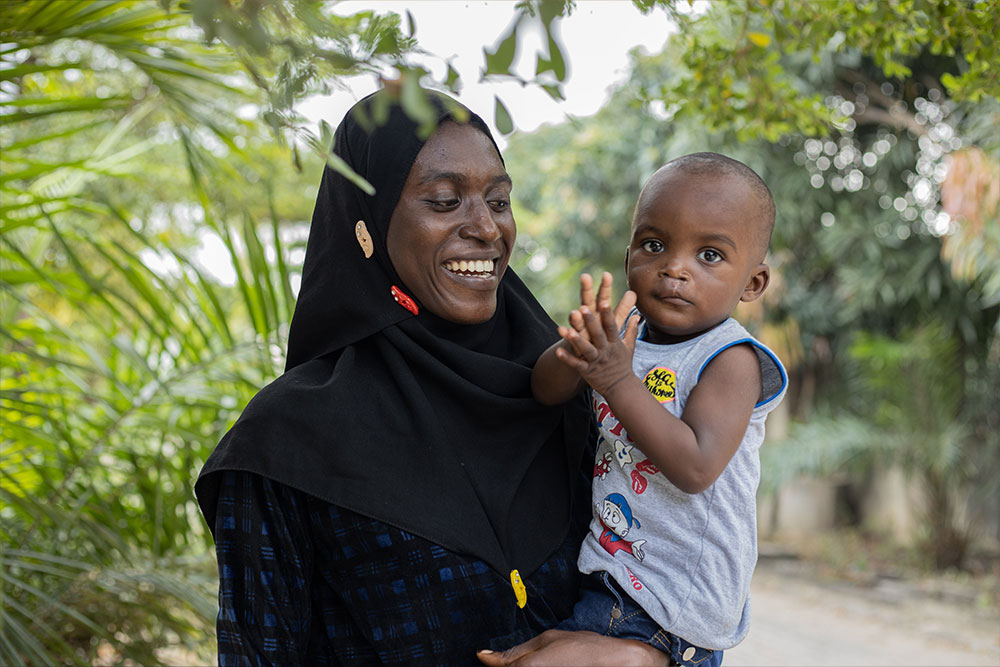 Olanike holding Muaz and smiling