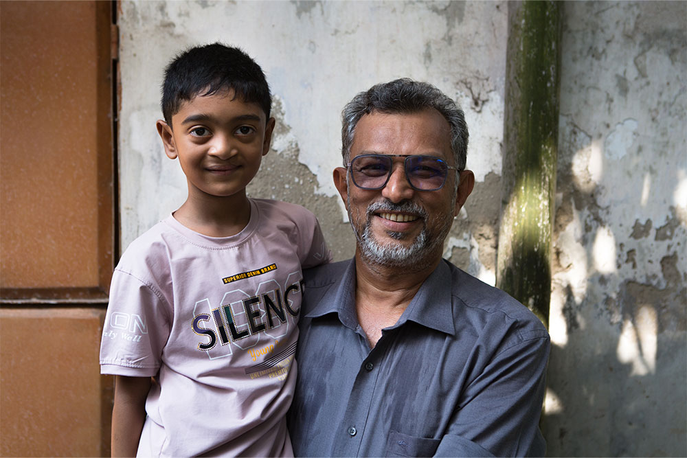 Mobasher with a Smile Train patient, a school-aged boy