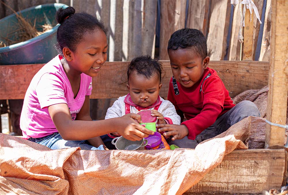 Tsiorihasina before cleft surgery, flanked by her sister and brother