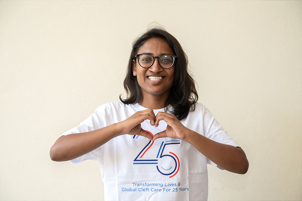 Dr. Mayuri making a heart with her fingers, the official International Women’s Day hand gesture