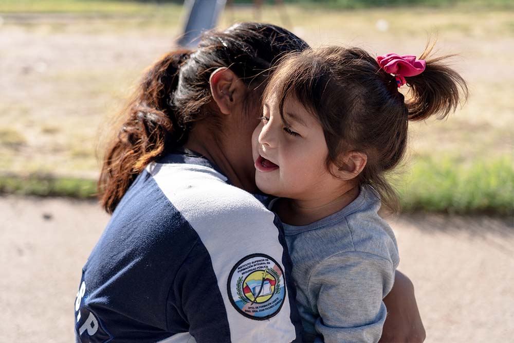 Jenifer and Isabella share a hug