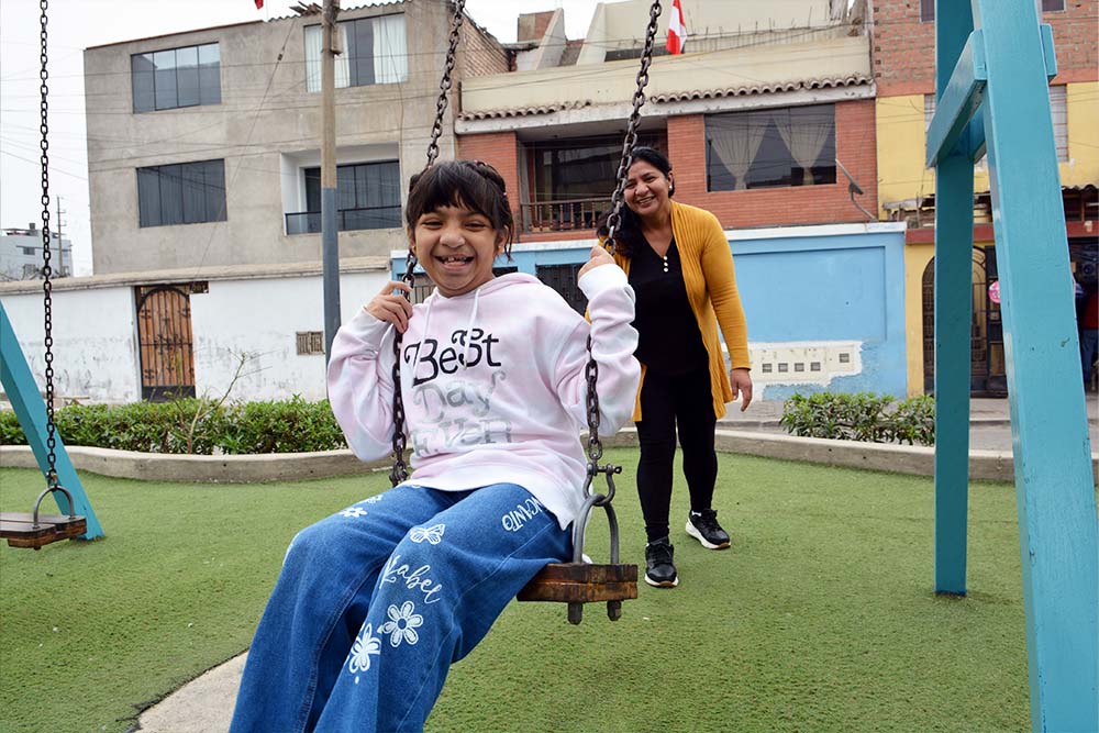 Bhania enjoys a swing at the playground