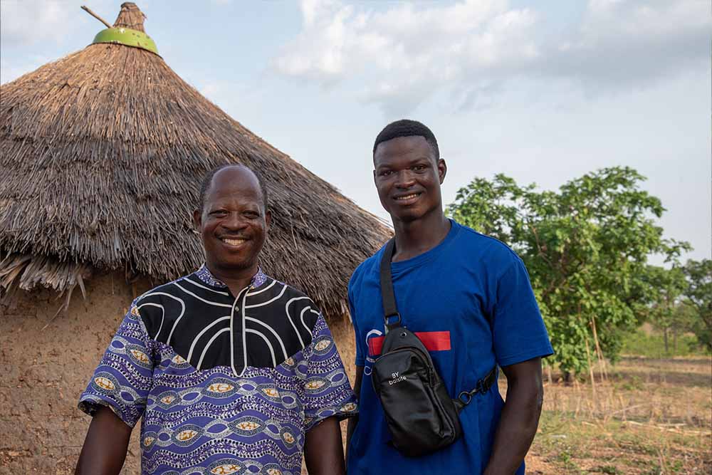 Koli and a local resident smile for the camera