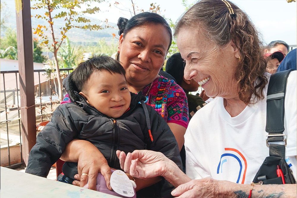 Karen with a patient and his mother in Guatemala