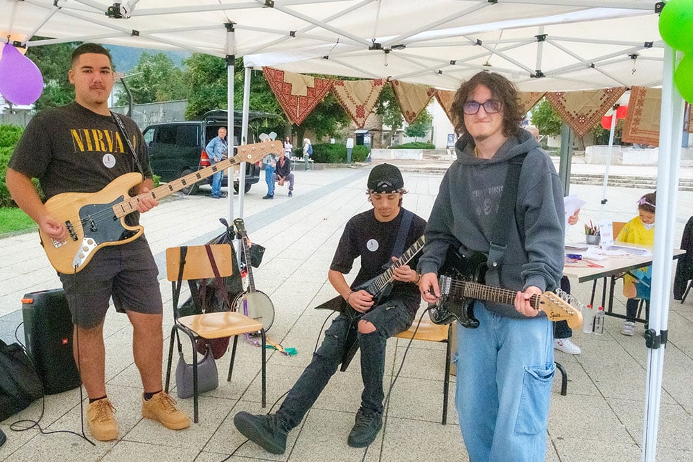 Three teenaged boys with guitars