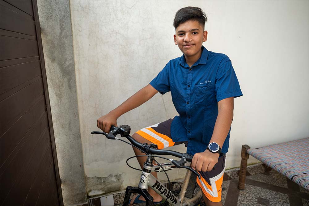 Swastik smiles and poses on his road bike