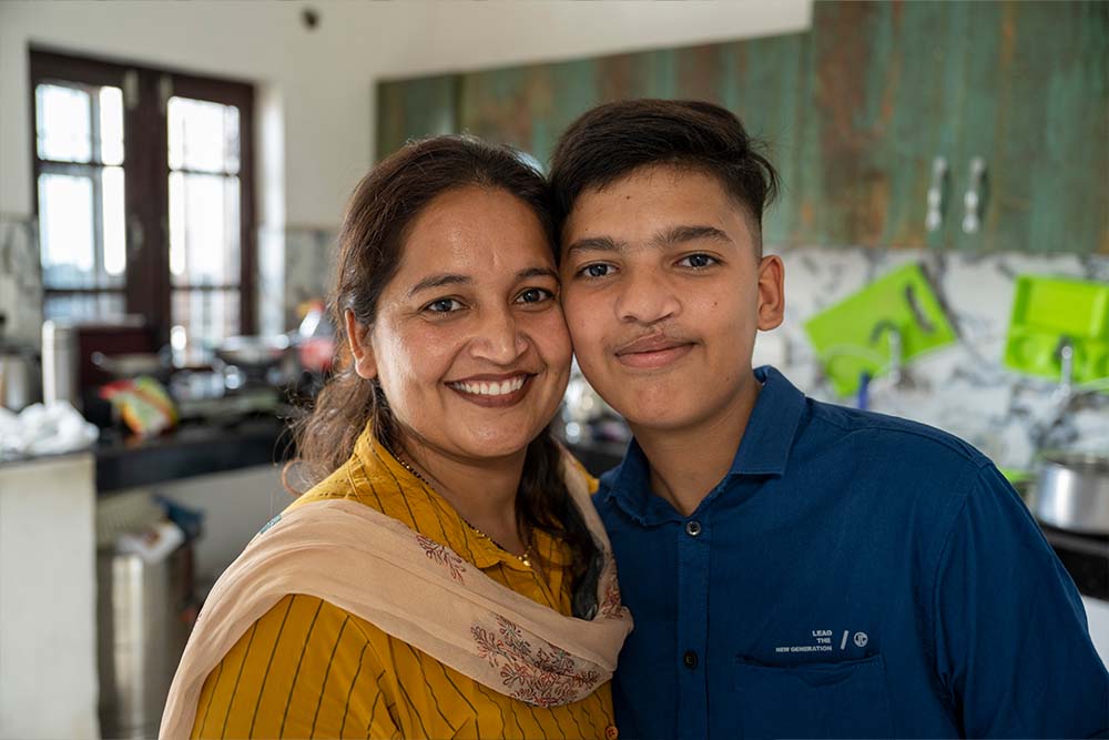 Reena and Swastik share a close smile side by side, their cheeks touching
