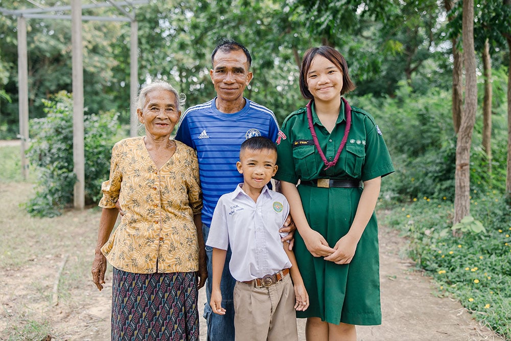 Anuwat, Aitya, Chaipishek, and Chaipishek’s mother smiling together