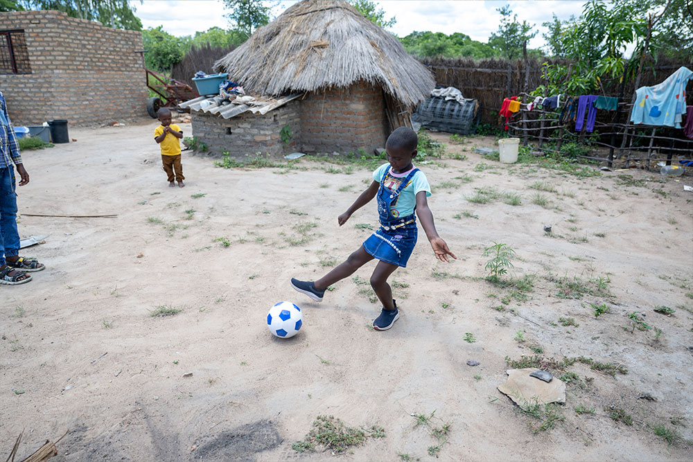 Janerose playing with a soccer ball
