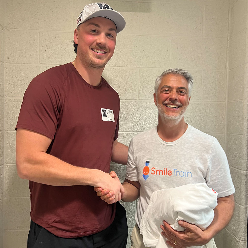 John Bates shaking hands with Brian Fontaine at Mercer Middle School in Aldie, VA