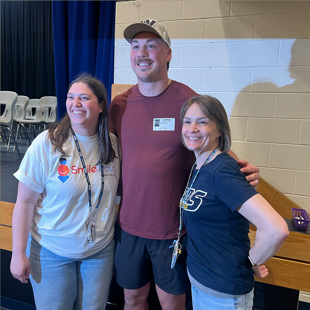 John posing with two Mercer teachers