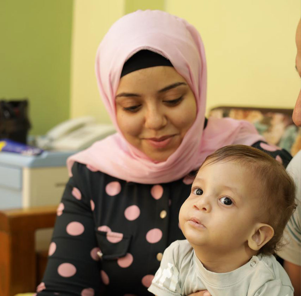 Esraa with Noah just after his cleft surgery