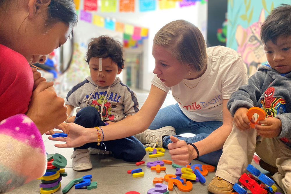 Sara playing with Smile Train patients
