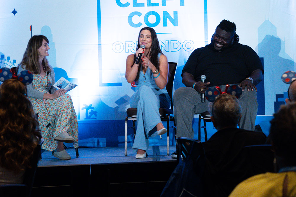 Adina, Autumn, and Isaac sharing a laugh on stage