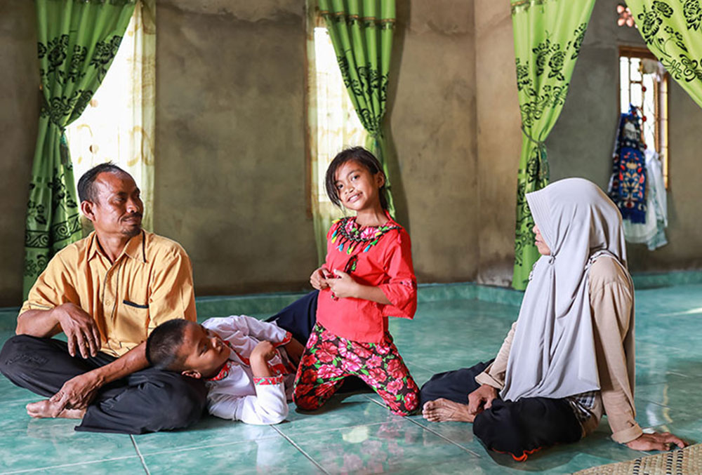 Aira with her family at a mosque