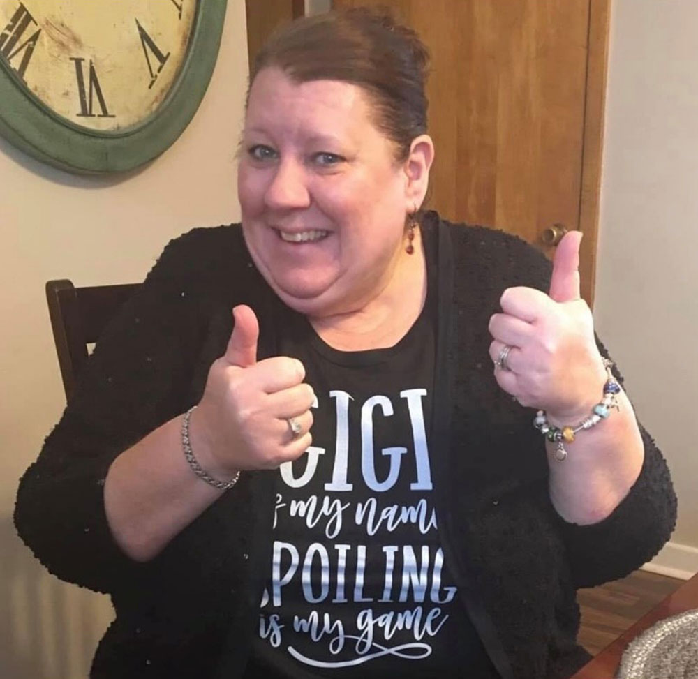 Chris 'Gigi' Rischette wearing a shirt saying 'Gigi is my name, spoiling is my game.'