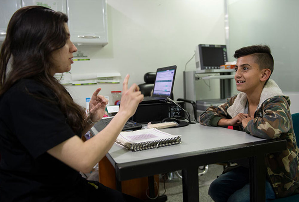 Cristian in a speech therapy session at Smile Train partner FISULAB