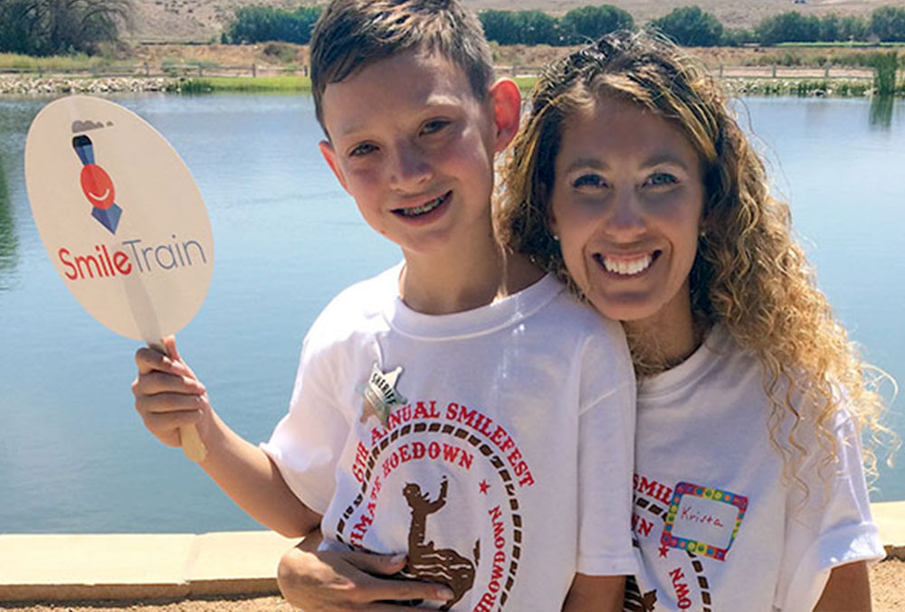 Krista Sullivan with her son with a cleft at Smile Fest