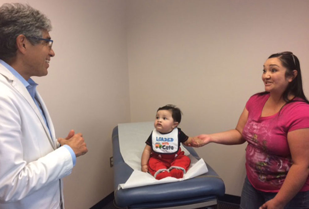 Dr. Cuadros speaks with the mother of a baby with a cleft.