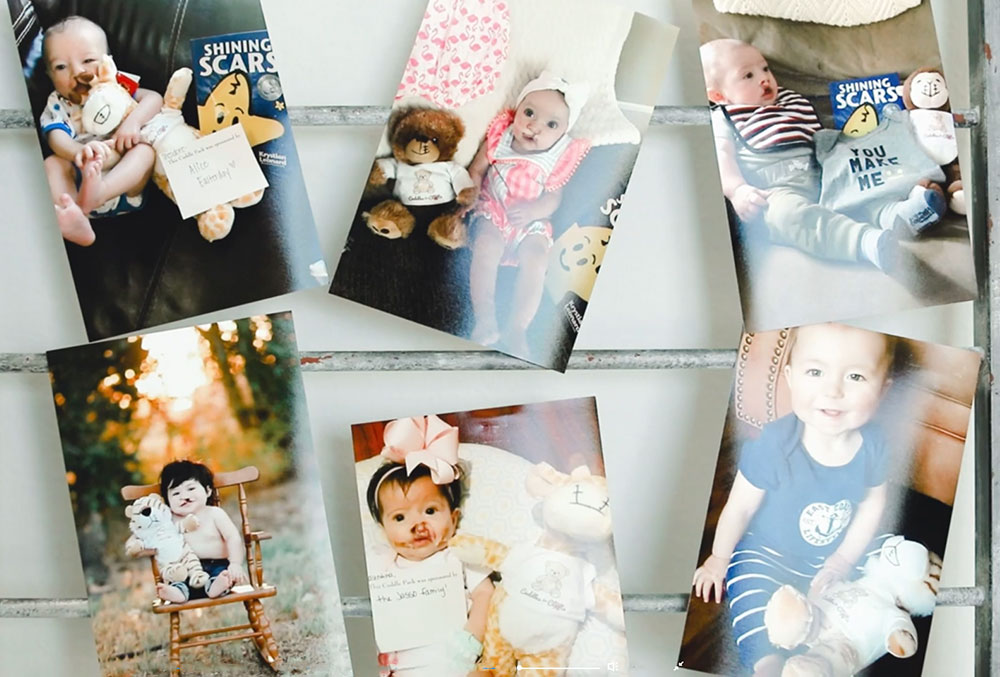 Polaroids babies with their Cuddle packs hung by clothespins