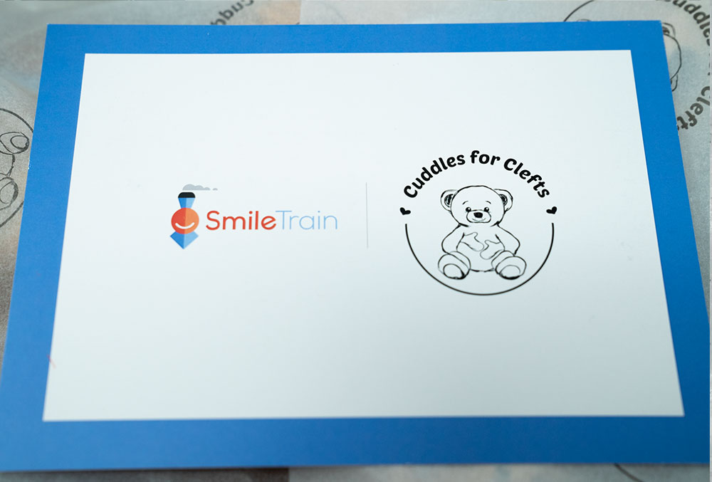 Lid of a closed Smile Train Cuddle Pack