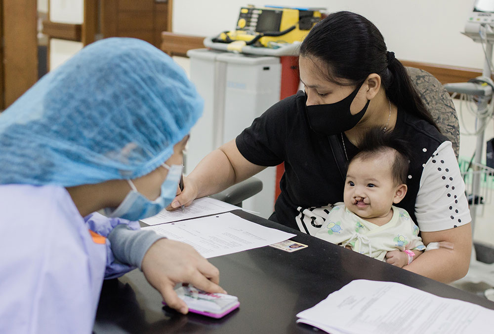 Maricel checking Elizabeth in for surgery