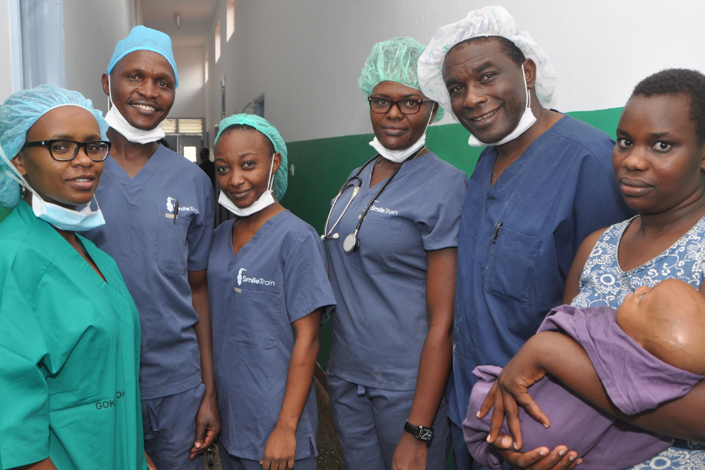 Esther poses with surgical team from Kenya