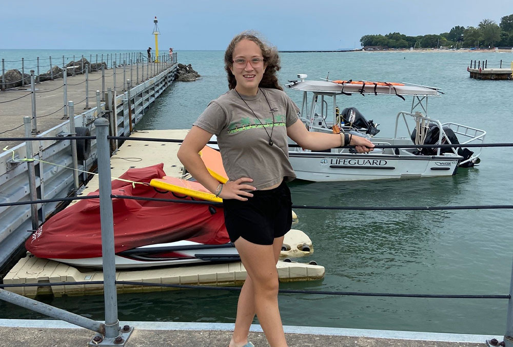 Grace smiles by Lake Michigan