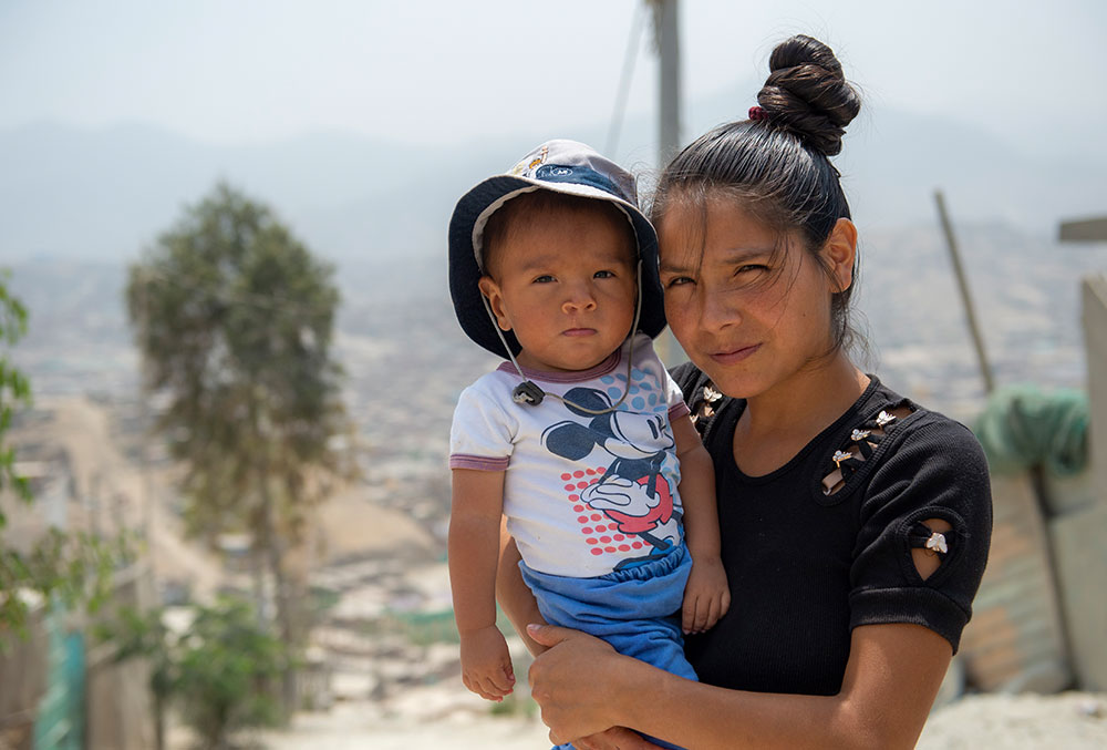 Zindia holding Joseyur after his free Smile Train-sponsored cleft surgery