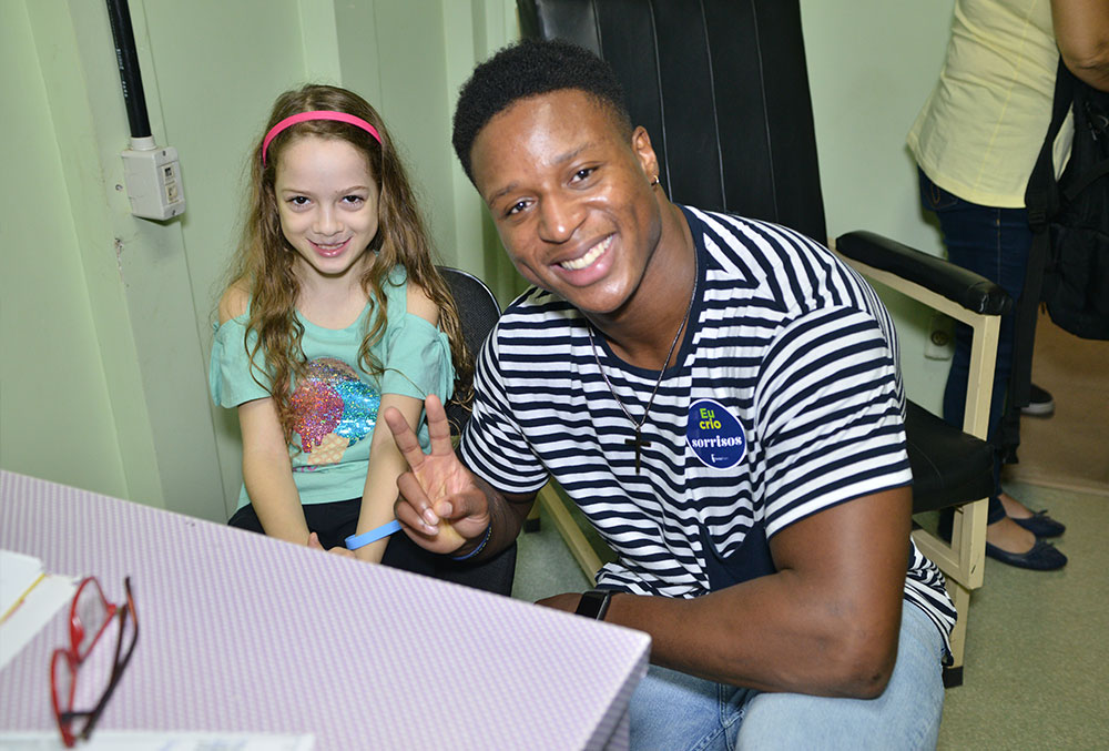 Kenyan Drake with a Smile Train patient in Brazil 