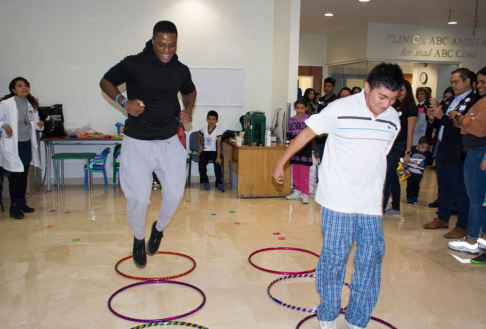 Kenyan Drake playing with Smile Train patients