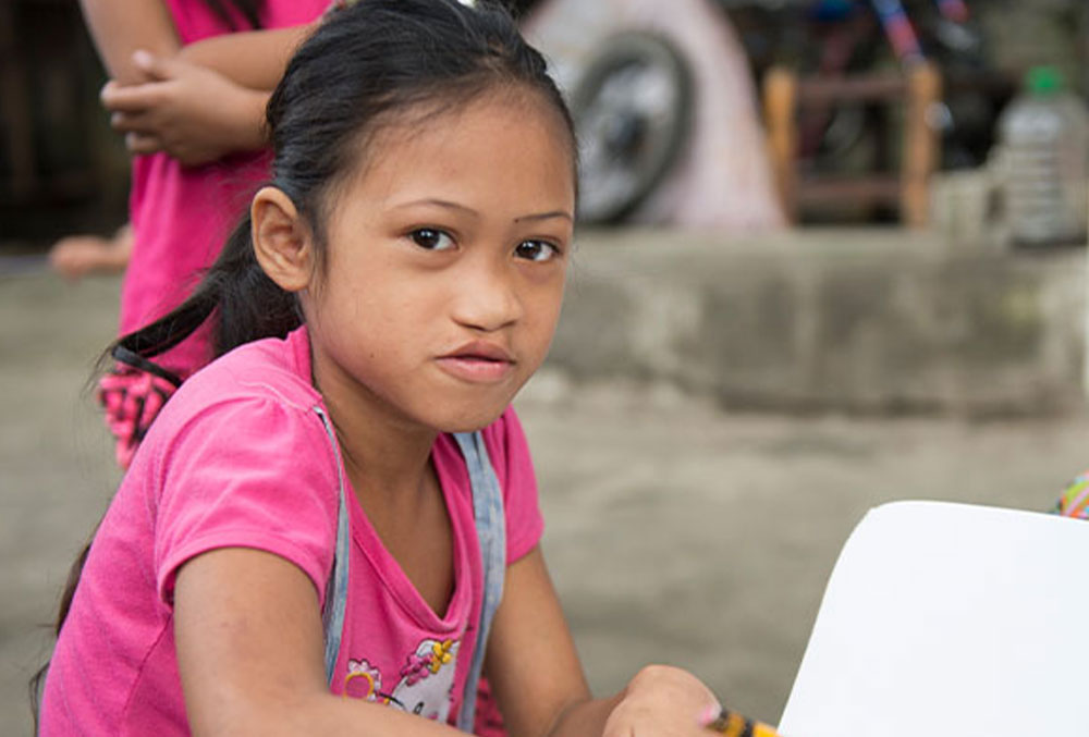 A Smile Train cleft patient writing