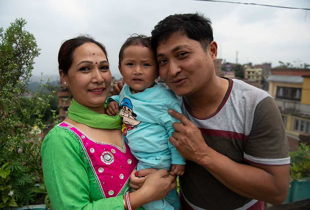 Mrighna with her father and mother after free Smile Train cleft surgery in Nepal