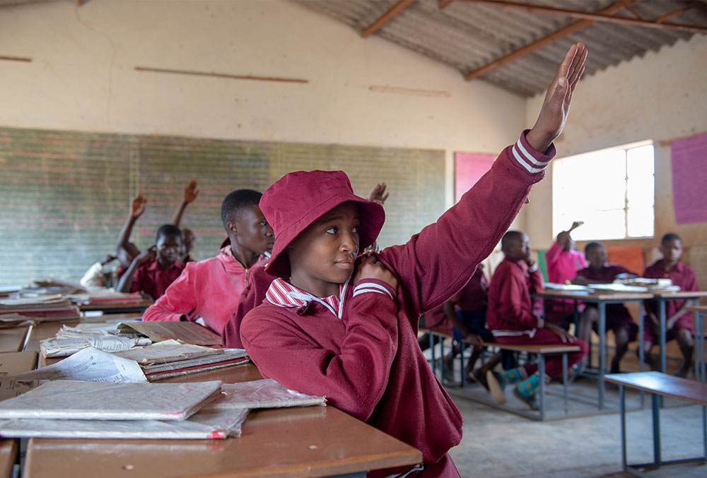 Munashe raises her hand with confidence after Smile Train-sponsored cleft lip surgery