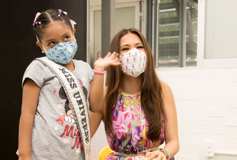 Andrea Meza with her Miss Universe sash over a Smile Train cleft patient in Mexico