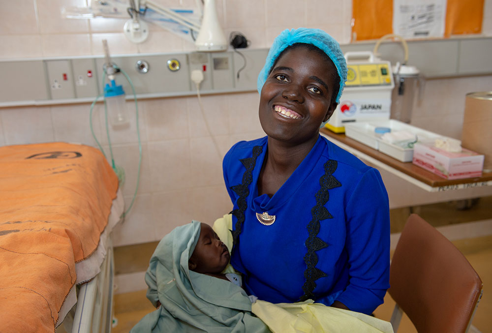 Rosemary holds Nyasha just after his free Smile Train-sponsored cleft surgery