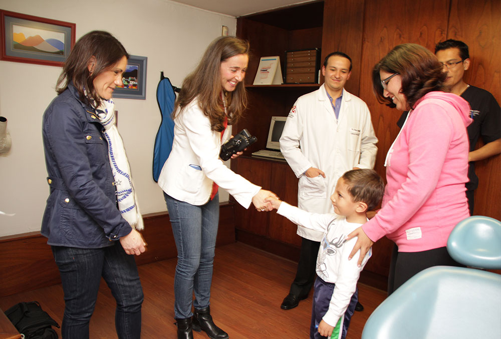 Pam greeting a patient in Latin America.