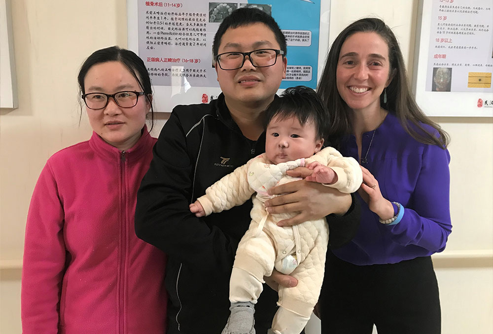Pam with a patient family in China