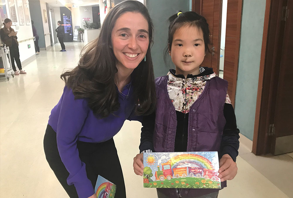 Pam with a patient in China